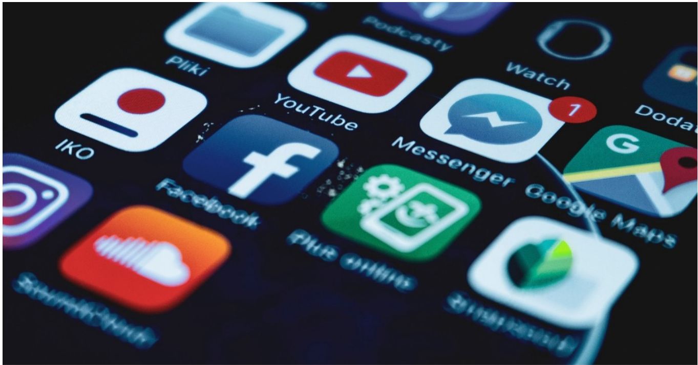 Smartphone home-screen of app icons, illustrating the data-rich digital surface that consumers now scrutinise.